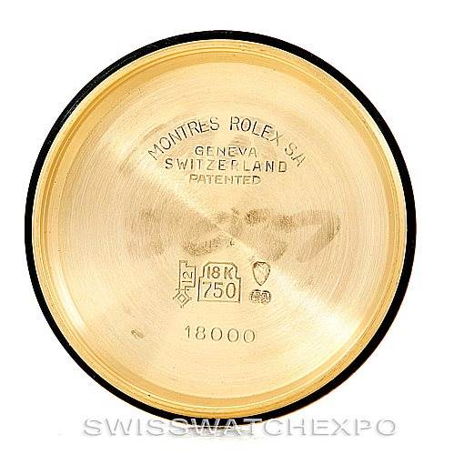 The image shows the interior of the case back of a Rolex President 18038 Men's Yellow Gold Brown Dial 18038 Men's Yellow Gold Brown Dial model watch, with engravings indicating gold purity and manufacturer details.