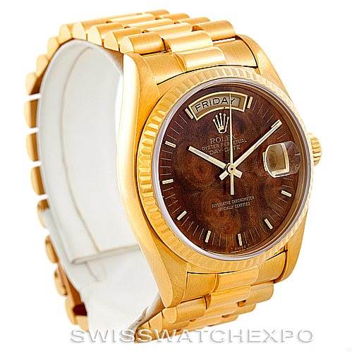 The image shows a Rolex President 18038 Men's Yellow Gold Brown Dial 18038 Men's Yellow Gold Brown Dial model watch from an oblique angle, highlighting its gold case, bracelet, and brown dial with a day-date feature.