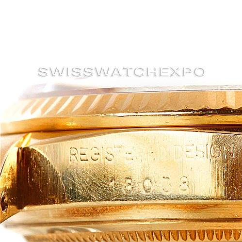 This close-up image shows the side profile of the Rolex President 18038 Men's Yellow Gold Brown Dial 18038 Men's Yellow Gold Brown Dial model watch, focusing on the bezel and the engraved serial number on the case.