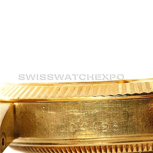 This image shows a close-up side angle of a Rolex President 1503 Men
s Yellow Gold Champagne Dial 1503 Men
s Yellow Gold Champagne Dial model watch, focusing on the serial number engraved on the case.