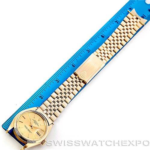 This image shows the full bracelet and face of a Rolex President 1503 Men
s Yellow Gold Champagne Dial 1503 Men
s Yellow Gold Champagne Dial model watch, with a ruler for scale.