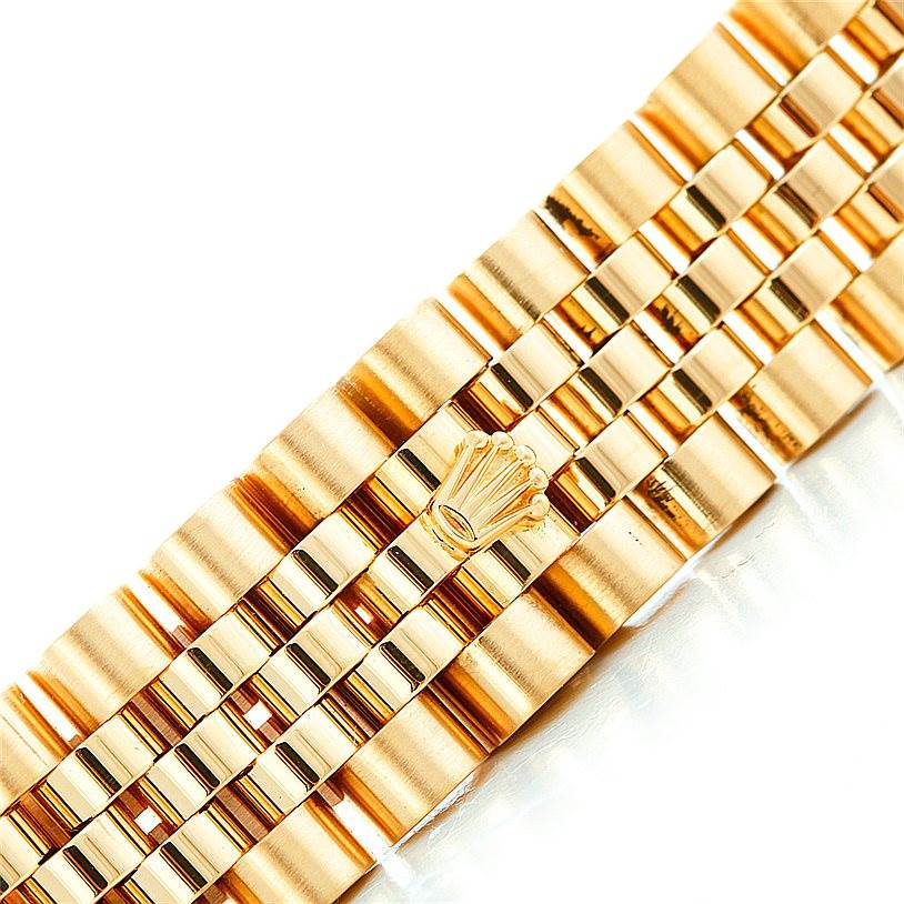 The image shows a close-up of the gold bracelet of a Rolex President 16018 Men's Yellow Gold Champagne Dial 16018 Men's Yellow Gold Champagne Dial model watch.