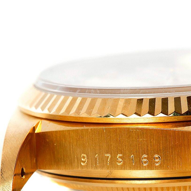 This image shows a close-up of the side, bezel, and serial number of a Rolex President 16018 Men's Yellow Gold Champagne Dial 16018 Men's Yellow Gold Champagne Dial model watch.