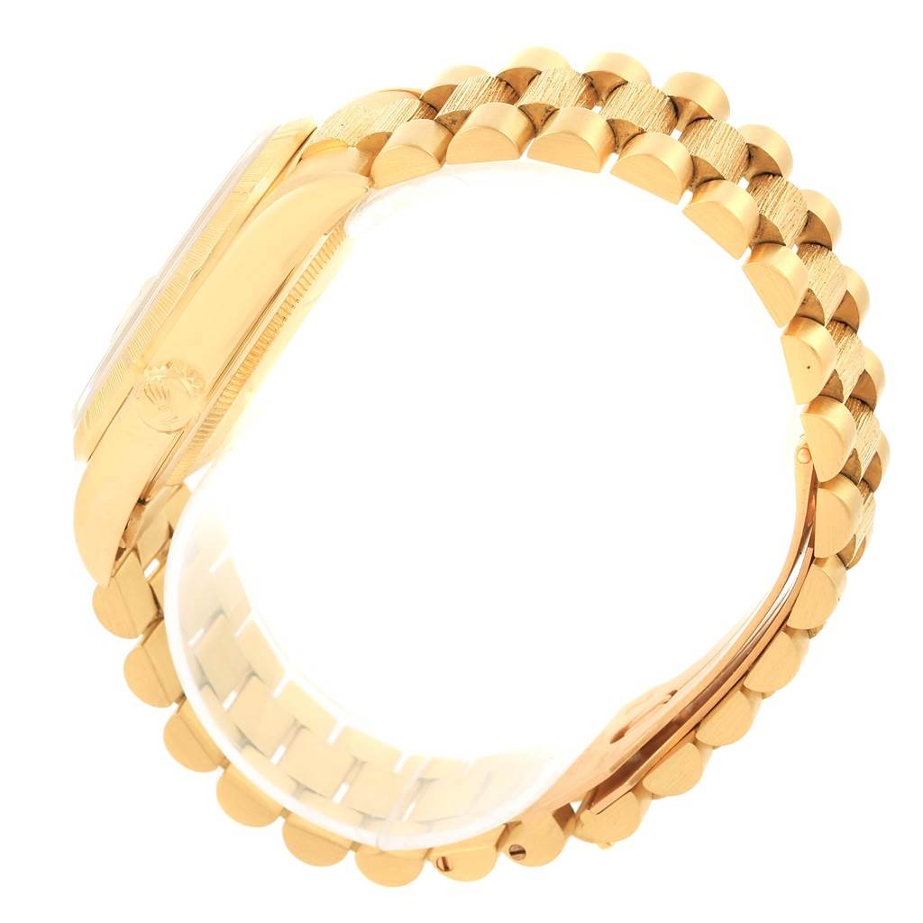 The image shows a side view of the gold bracelet and case of a Rolex President 18248 Men's Yellow Gold Champagne Dial 18248 Men's Yellow Gold Champagne Dial model watch.