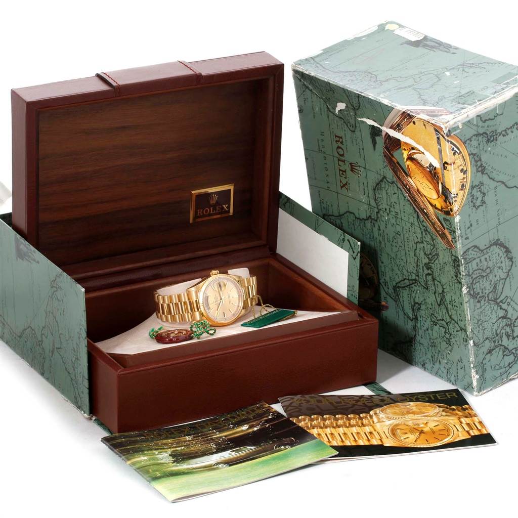 The image shows a Rolex President 18248 Men's Yellow Gold Champagne Dial 18248 Men's Yellow Gold Champagne Dial model watch in a wooden box, along with manuals, an outer green box, and tags.