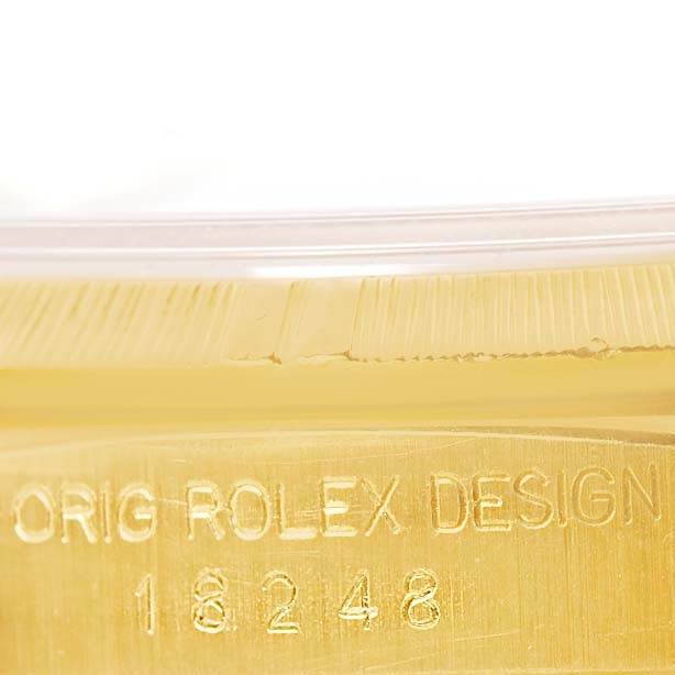 This image shows a close-up of the engraved model number and bezel of a Rolex President 18248 Men's Yellow Gold Champagne Dial 18248 Men's Yellow Gold Champagne Dial watch.