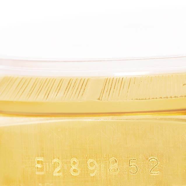 The image shows a close-up of the serial number engraved on the case of the Rolex President 18248 Men's Yellow Gold Champagne Dial 18248 Men's Yellow Gold Champagne Dial model watch.