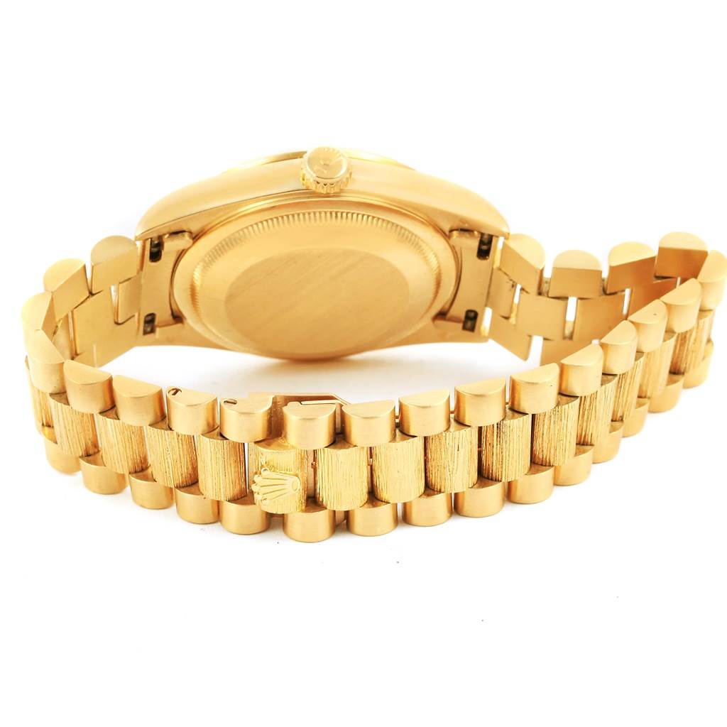 The image shows the back of a Rolex President 18248 Men's Yellow Gold Champagne Dial 18248 Men's Yellow Gold Champagne Dial model watch, highlighting its gold case back and bracelet with the clasp.