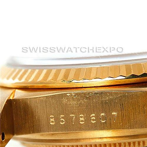 The image shows a close-up of the side and bezel of a Rolex President 18038 Men's Yellow Gold Black Dial 18038 Men's Yellow Gold Black Dial model watch, including the serial number.