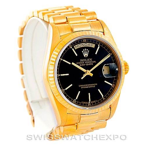 The image shows a Rolex President 18038 Men's Yellow Gold Black Dial 18038 Men's Yellow Gold Black Dial model watch at an angled view, highlighting the black dial, day-date display, and gold bracelet.