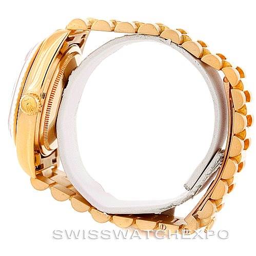 The image shows a side view of a Rolex President 18038 Men's Yellow Gold Black Dial 18038 Men's Yellow Gold Black Dial model, highlighting its gold case, crown, and bracelet.