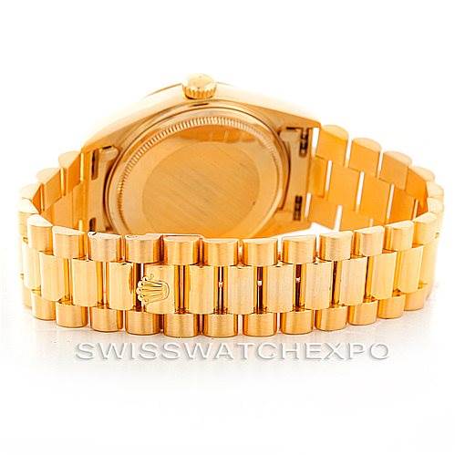 The image shows the back view of a Rolex President 18038 Men's Yellow Gold Black Dial 18038 Men's Yellow Gold Black Dial model watch, highlighting the gold bracelet and case back.