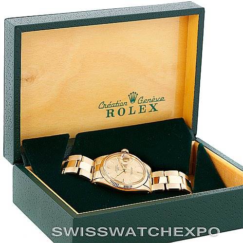 The image shows a Rolex President 1503 Men
s Yellow Gold Champagne Dial 1503 Men
s Yellow Gold Champagne Dial model watch inside an open green and wooden box, viewed from a front angle.