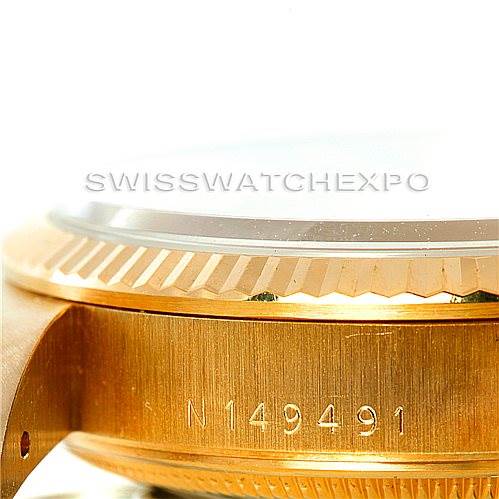 The image shows a close-up of the side view of a Rolex President 15238 Men
s Yellow Gold Champagne Dial 15238 Men
s Yellow Gold Champagne Dial model watch, highlighting the bezel, crystal, and case with a serial number.