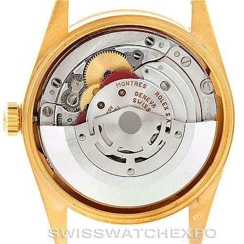 The image shows the back view of a Rolex President 15238 Men
s Yellow Gold Champagne Dial 15238 Men
s Yellow Gold Champagne Dial model watch, highlighting its intricate movement and internal components.