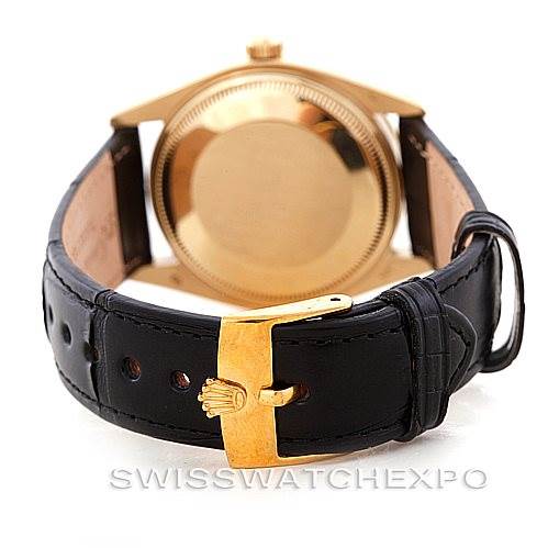 This image shows the back case and leather strap with clasp of a Rolex President 1503 Men's Yellow Gold Black Dial 1503 Men's Yellow Gold Black Dial model.