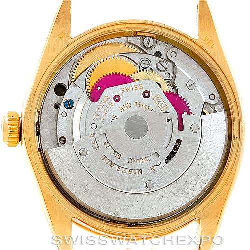 This image shows the internal mechanism of a Rolex President 1002 Men's Steel and Gold (two tone) Black Dial 1002 Men's Steel and Gold (two tone) Black Dial model watch, viewed from the back with its case opened.