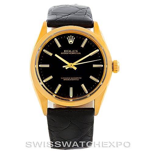 The image shows a front view of a Rolex President 1002 Men's Steel and Gold (two tone) Black Dial 1002 Men's Steel and Gold (two tone) Black Dial model watch with a black leather strap, gold case, and black dial.