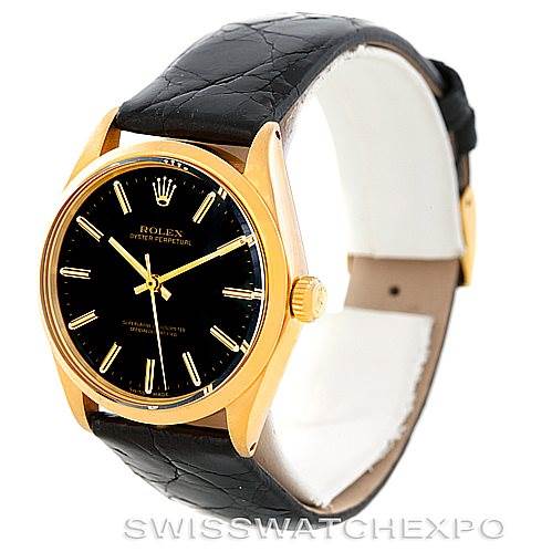 The image shows a side angle of the Rolex President 1002 Men's Steel and Gold (two tone) Black Dial 1002 Men's Steel and Gold (two tone) Black Dial model watch, featuring its black dial, gold case, and black leather strap.
