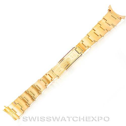 This image shows a gold bracelet from the Rolex President Men's  Men's  model, displayed flat with the clasp visible at the center.