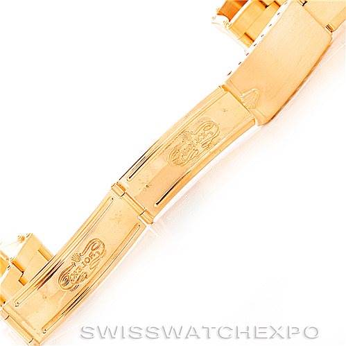 The image shows a close-up of the gold bracelet clasp of a Rolex President Men's  Men's  model watch.
