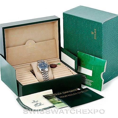 The image shows a Rolex President 18206 Men's Platinum Blue Dial 18206 Men's Platinum Blue Dial model watch in its case with manuals, a cleaning cloth, and a green outer box.