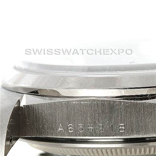 The image shows a close-up of the side of a Rolex President 18206 Men's Platinum Blue Dial 18206 Men's Platinum Blue Dial watch, highlighting the serial number and part of the bezel.