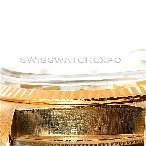 The image shows a close-up of a Rolex President 1803 Men
s Yellow Gold Silver Dial 1803 Men
s Yellow Gold Silver Dial model
s side, highlighting the fluted bezel and part of the watch
s serial number engraved on the case.