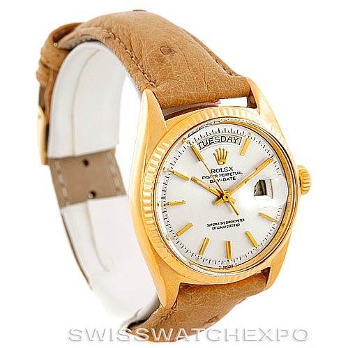 The image shows a Rolex President 1803 Men
s Yellow Gold Silver Dial 1803 Men
s Yellow Gold Silver Dial model watch at a three-quarter angle, highlighting its gold case, white dial, and brown leather strap.