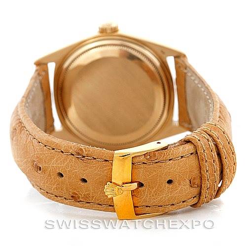 This image shows the back view of a Rolex President 1803 Men
s Yellow Gold Silver Dial 1803 Men
s Yellow Gold Silver Dial model watch, highlighting its leather strap and gold clasp.