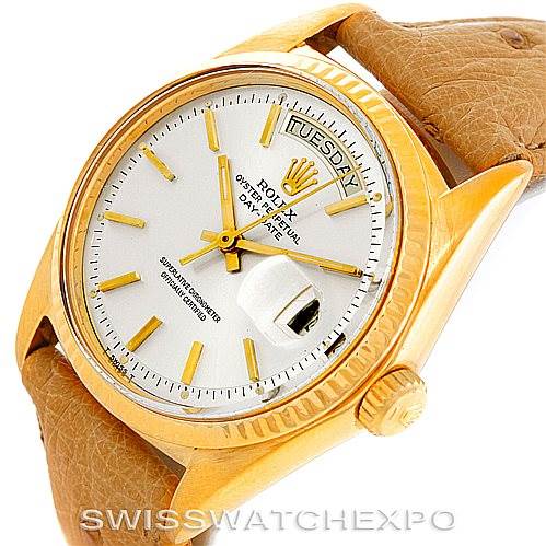 This image shows a close-up angle of a Rolex President 1803 Men
s Yellow Gold Silver Dial 1803 Men
s Yellow Gold Silver Dial model watch, highlighting its dial, case, and part of the leather strap.