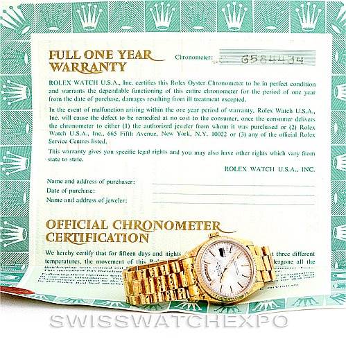 The image shows the Rolex President 18038 Men
s Yellow Gold Silver Dial 18038 Men
s Yellow Gold Silver Dial watch, placed on its warranty and chronometer certification papers, photographed from above.