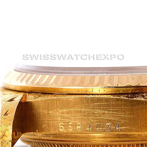 The image shows a close-up of the side angle of a Rolex President 18038 Men
s Yellow Gold Silver Dial 18038 Men
s Yellow Gold Silver Dial watch, focusing on the bezel, case, and part of the band.