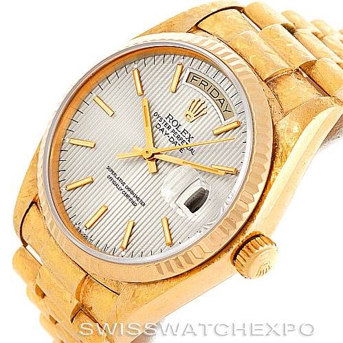 The image shows a close-up of the watch face, bezel, and part of the bracelet of a Rolex President 18038 Men
s Yellow Gold Silver Dial 18038 Men
s Yellow Gold Silver Dial model.