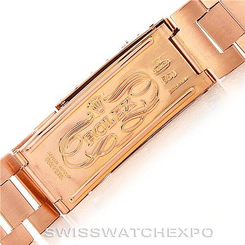 This is a close-up view of the clasp of a Rolex President 1803 Men
s Rose Gold Black Dial 1803 Men
s Rose Gold Black Dial model watch, displaying the engraved Rolex branding.
