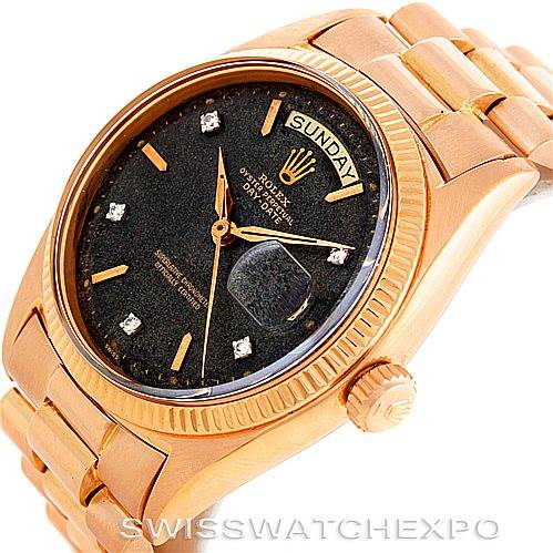 The image shows a close-up of a Rolex President 1803 Men
s Rose Gold Black Dial 1803 Men
s Rose Gold Black Dial model watch, featuring its black dial, day-date display, and gold bracelet.