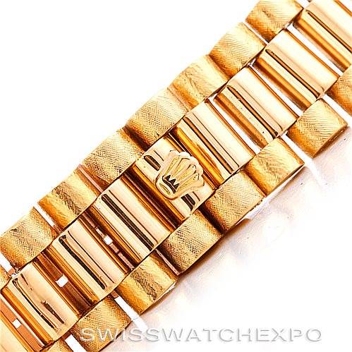 This image shows a close-up of the gold bracelet with an engraved crown logo of the Rolex President 1803 Men
s Yellow Gold Champagne Dial 1803 Men
s Yellow Gold Champagne Dial model watch.