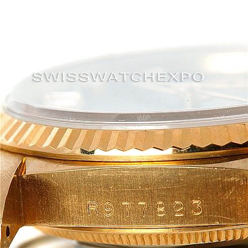 This image shows a close-up of the side and beveled edge of a Rolex President 18238 Men's Yellow Gold Blue Dial 18238 Men's Yellow Gold Blue Dial watch, highlighting the serial number and bezel detail.