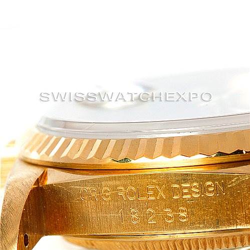 This image shows the side view of a Rolex President 18238 Men's Yellow Gold Blue Dial 18238 Men's Yellow Gold Blue Dial model, focusing on the gold case and the engraved "ORIG ROLEX DESIGN 18238" text.