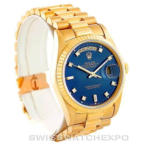 The image shows a Rolex President 18238 Men's Yellow Gold Blue Dial 18238 Men's Yellow Gold Blue Dial model watch, highlighting its gold bracelet, blue dial, and day-date display, viewed from an angled perspective.