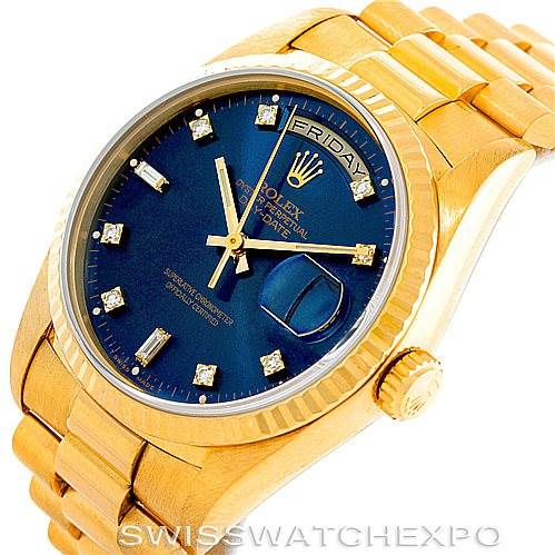 The image shows a Rolex President 18238 Men's Yellow Gold Blue Dial 18238 Men's Yellow Gold Blue Dial model watch at a slight tilted angle, highlighting the gold band, blue dial, crown, and date window.