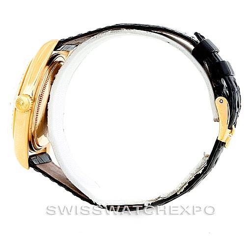 Side view of a Rolex President 1803 Men
s Yellow Gold Silver Dial 1803 Men
s Yellow Gold Silver Dial model watch, showcasing the crown, bezel, and leather strap.