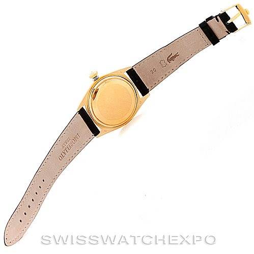 The image shows the back of the Rolex President 1803 Men
s Yellow Gold Silver Dial 1803 Men
s Yellow Gold Silver Dial model, including the case and leather strap laid flat.