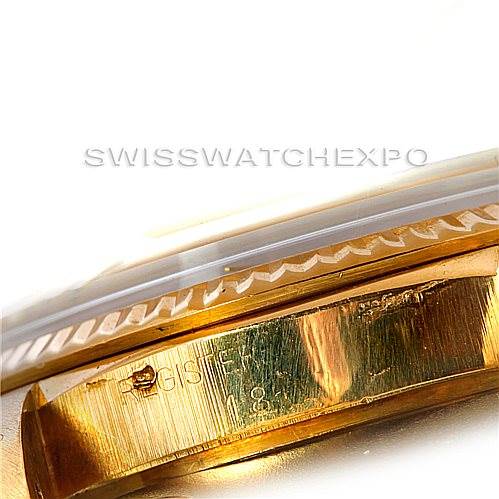 This close-up image shows part of the case and bezel of a Rolex President 1803 Men
s Yellow Gold Silver Dial 1803 Men
s Yellow Gold Silver Dial watch.