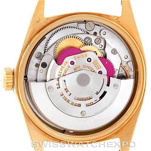 This image shows a close-up view of the movement inside a Rolex President 1803 Men
s Yellow Gold Champagne Dial 1803 Men
s Yellow Gold Champagne Dial model watch, highlighting its gears and inner mechanics.