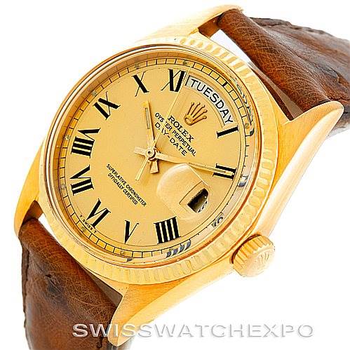 The image shows a Rolex President 1803 Men
s Yellow Gold Champagne Dial 1803 Men
s Yellow Gold Champagne Dial watch from an angle highlighting the dial, bezel, crown, and part of the strap.
