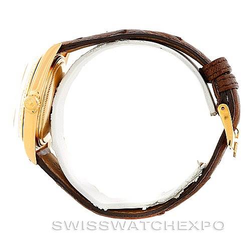 This is a side view of a Rolex President 1803 Men
s Yellow Gold Champagne Dial 1803 Men
s Yellow Gold Champagne Dial model watch, showcasing its gold case and brown leather strap.