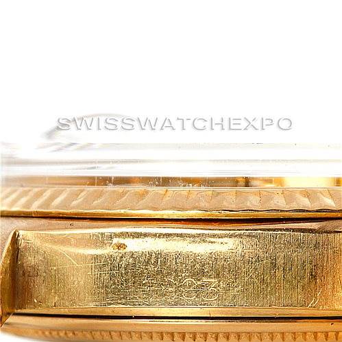 The image shows a close-up side view of a Rolex President 1803 Men
s Yellow Gold Silver Dial 1803 Men
s Yellow Gold Silver Dial watch case, including part of the bezel and the side of the case.