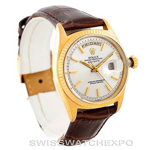 This image shows the face and strap of a Rolex President 1803 Men
s Yellow Gold Silver Dial 1803 Men
s Yellow Gold Silver Dial model watch with a white dial and brown leather strap.