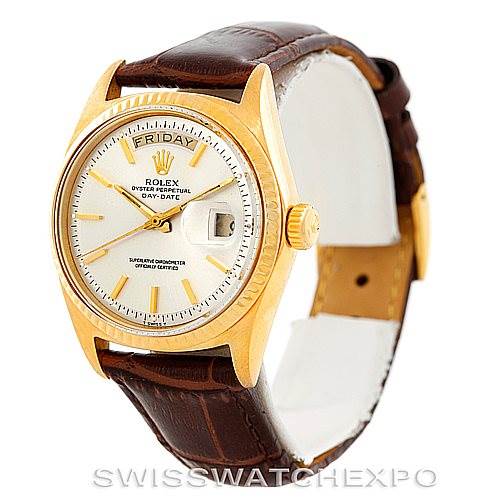 The image shows a front angled view of a Rolex President 1803 Men
s Yellow Gold Silver Dial 1803 Men
s Yellow Gold Silver Dial Day-Date with gold casing and a brown leather strap.